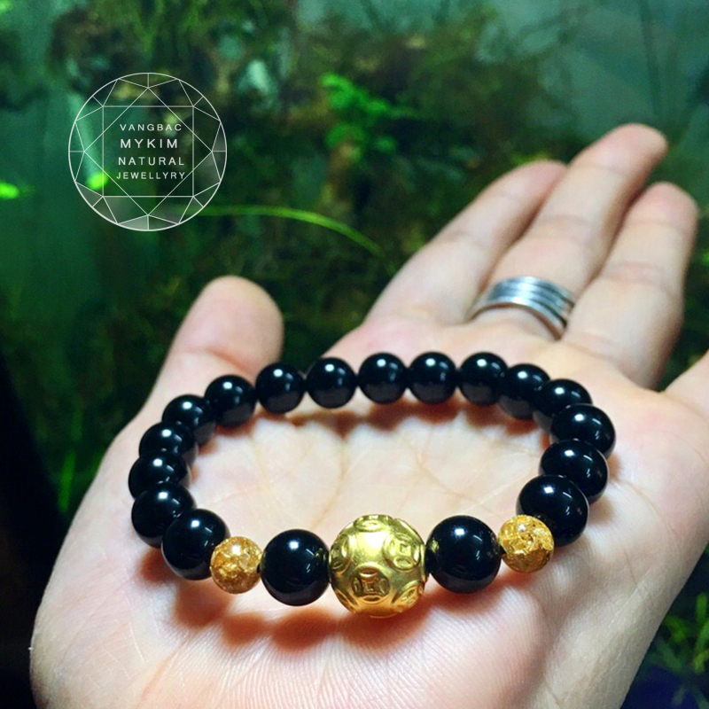 Vòng đá tektit mix charm kim tiền vàng 