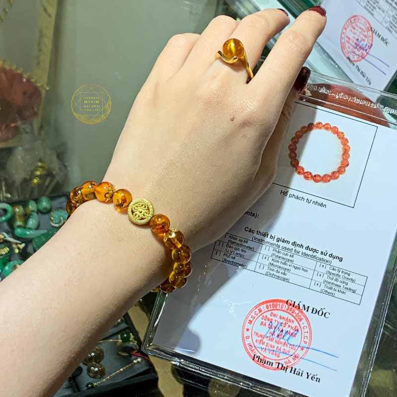 Vòng hổ phách vip vàng ong mix charm bánh xe pháp luân  vàng 24k
